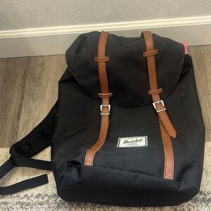 Hershel backpack jaw string closure leather snap closure front straps